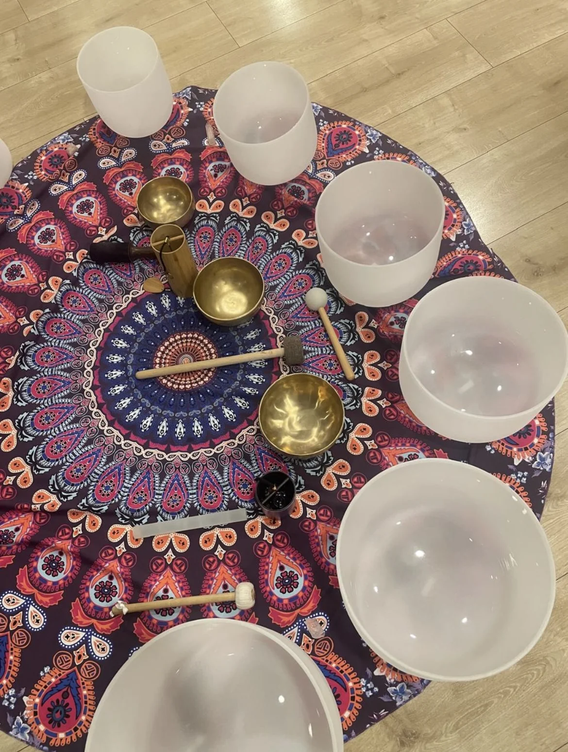 Julie's crystal and Himalayan singing bowls arranged for a sound bath
